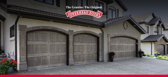Three brown overhead garage doors
