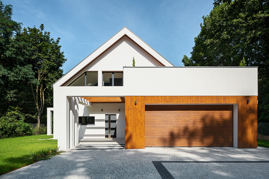 A modern home featuring a modern-style garage door.